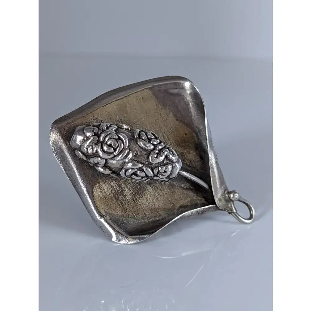 Silver steed unique silver leaf-shaped brooch with intricate rose and floral embossing, matching extravagant leaf rings