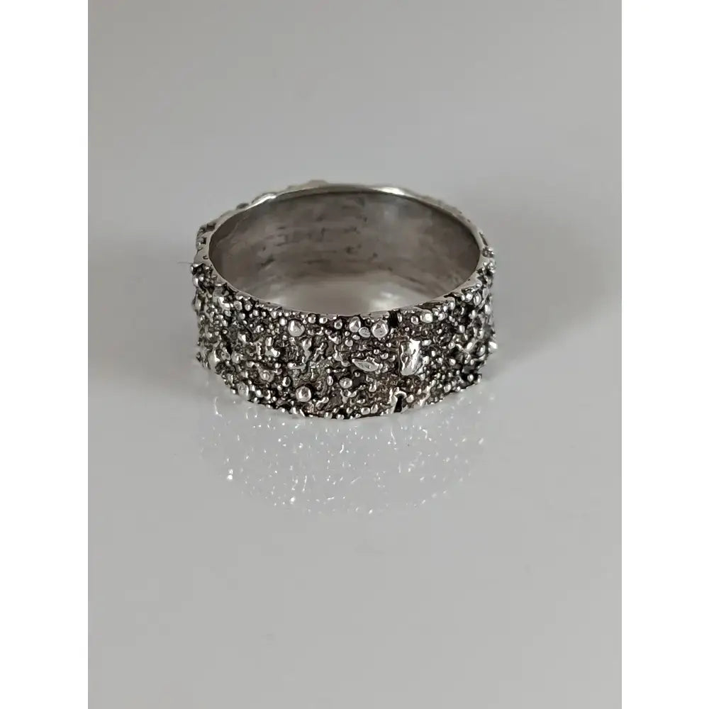 Silver steed unique structure ring crafted in textured silver with a rough bead-like surface and organic design