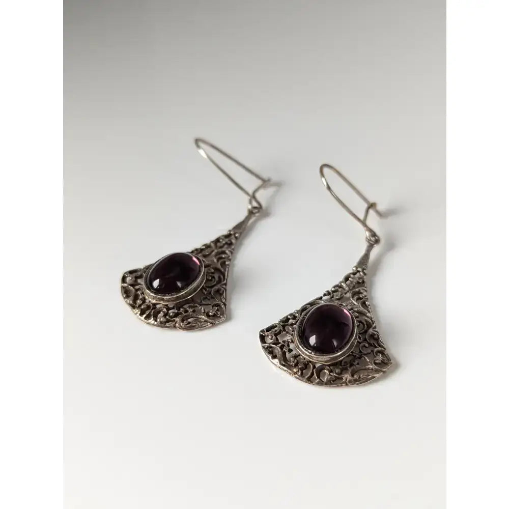 Silver steed vintage filigree purple dropped earrings with oval purple gemstones in ornate fan-shaped silver dangle design