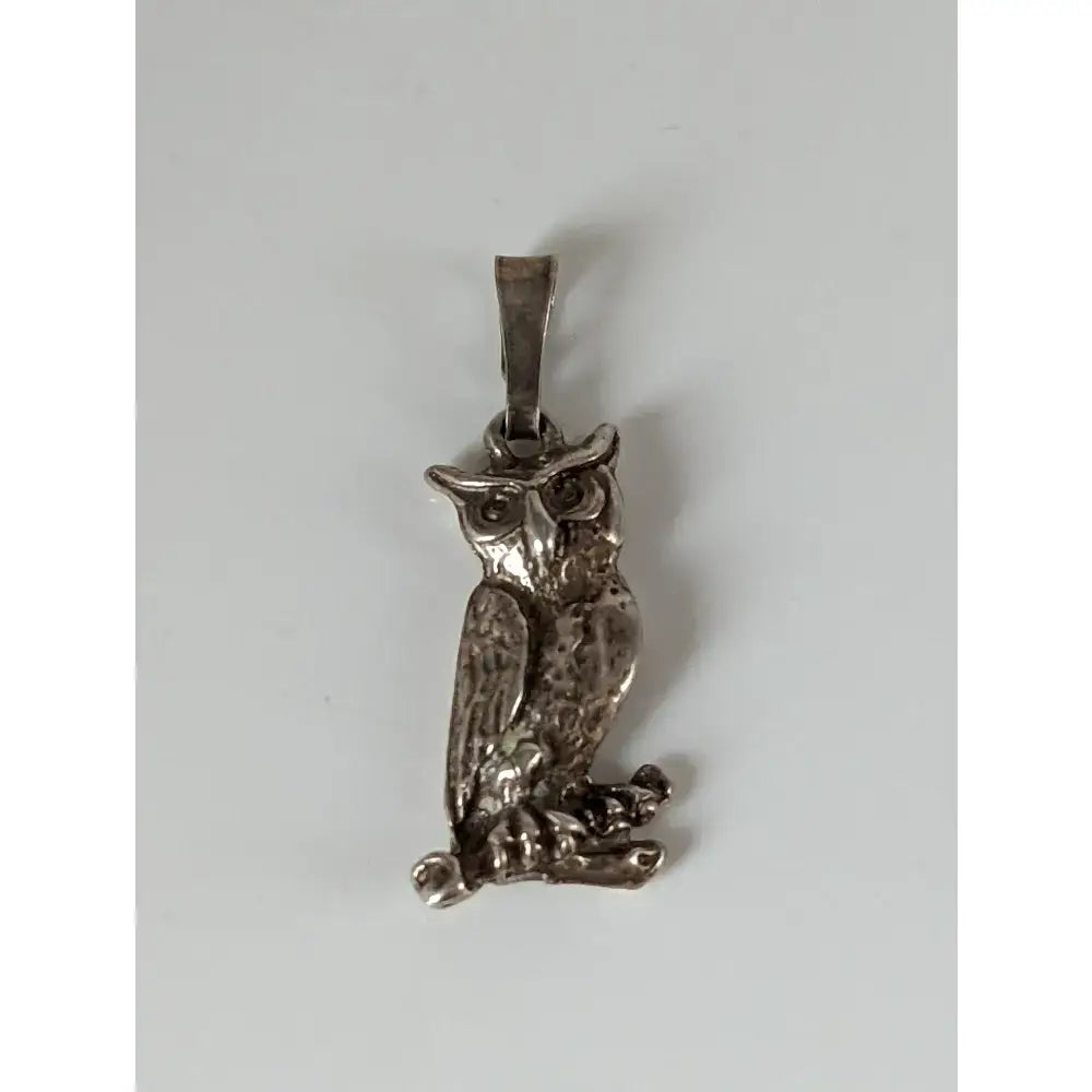 Silver steed wise owl silver pendant with detailed textured feathers and polished metallic silver finish
