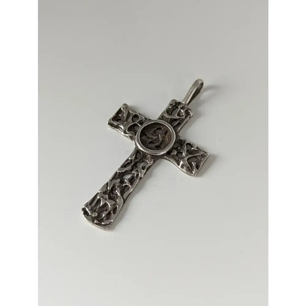Silver steed woven cross silver pendant with intricate filigree and central circular medallion in silver