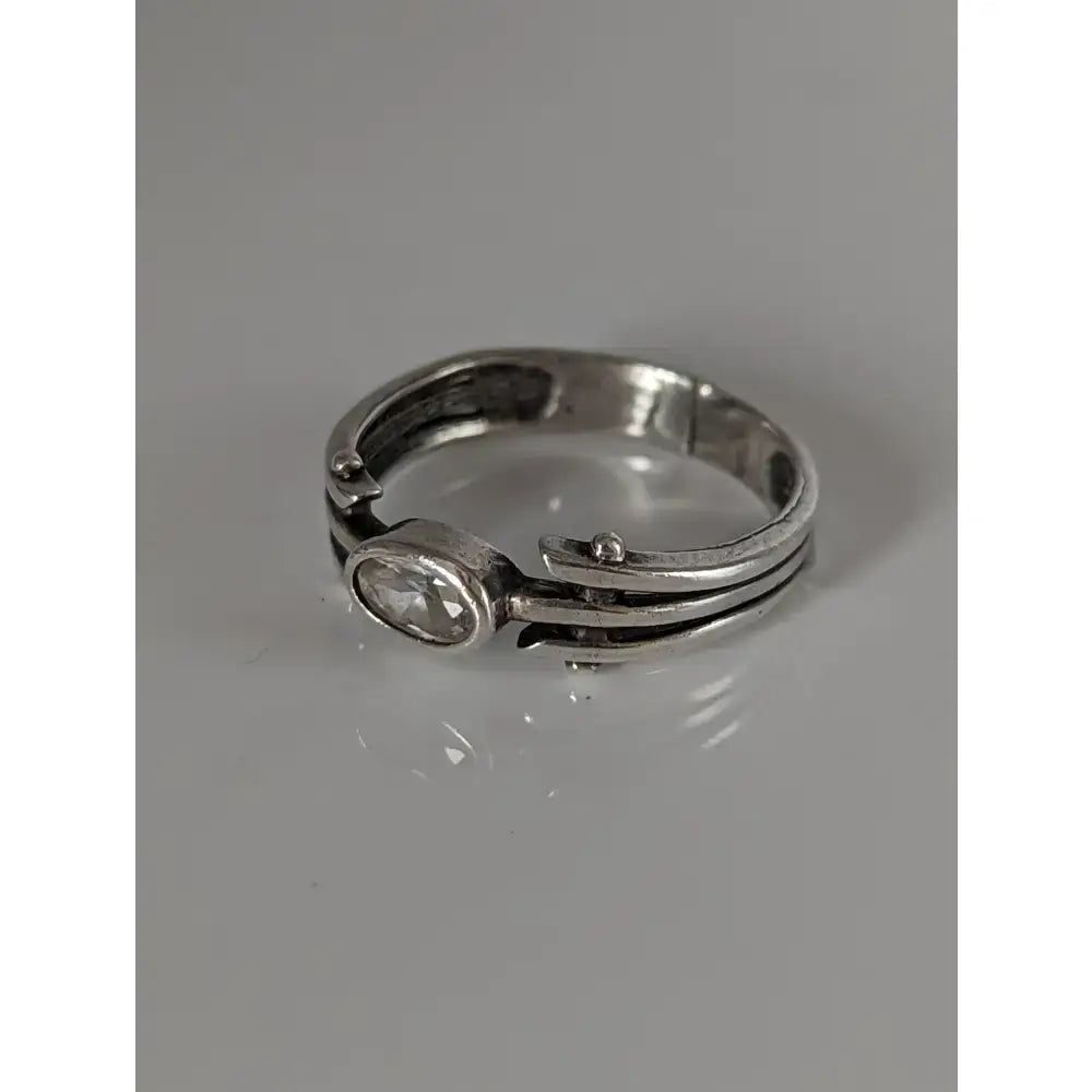 Silver steed silver zirconia antique ring with a clear oval-cut gemstone and intricate layered band design