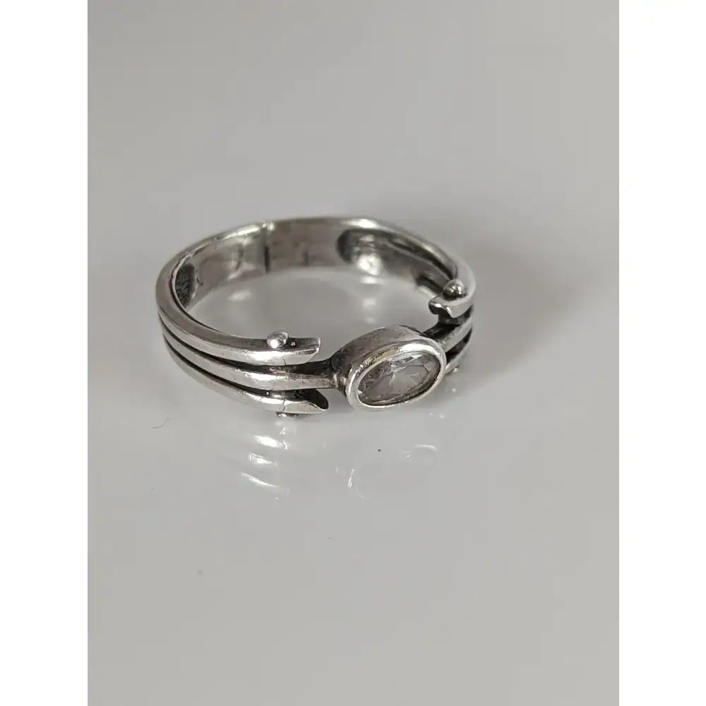 Silver steed zirconia antique ring with a clear oval-cut gemstone and an intricate layered silver band design