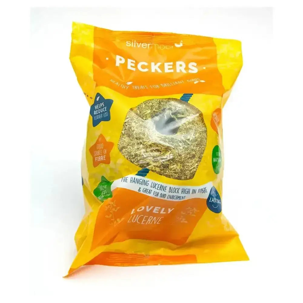 A bright yellow and orange hanging lucerne block by silver treats promoting natural pecking peckers chicken treats