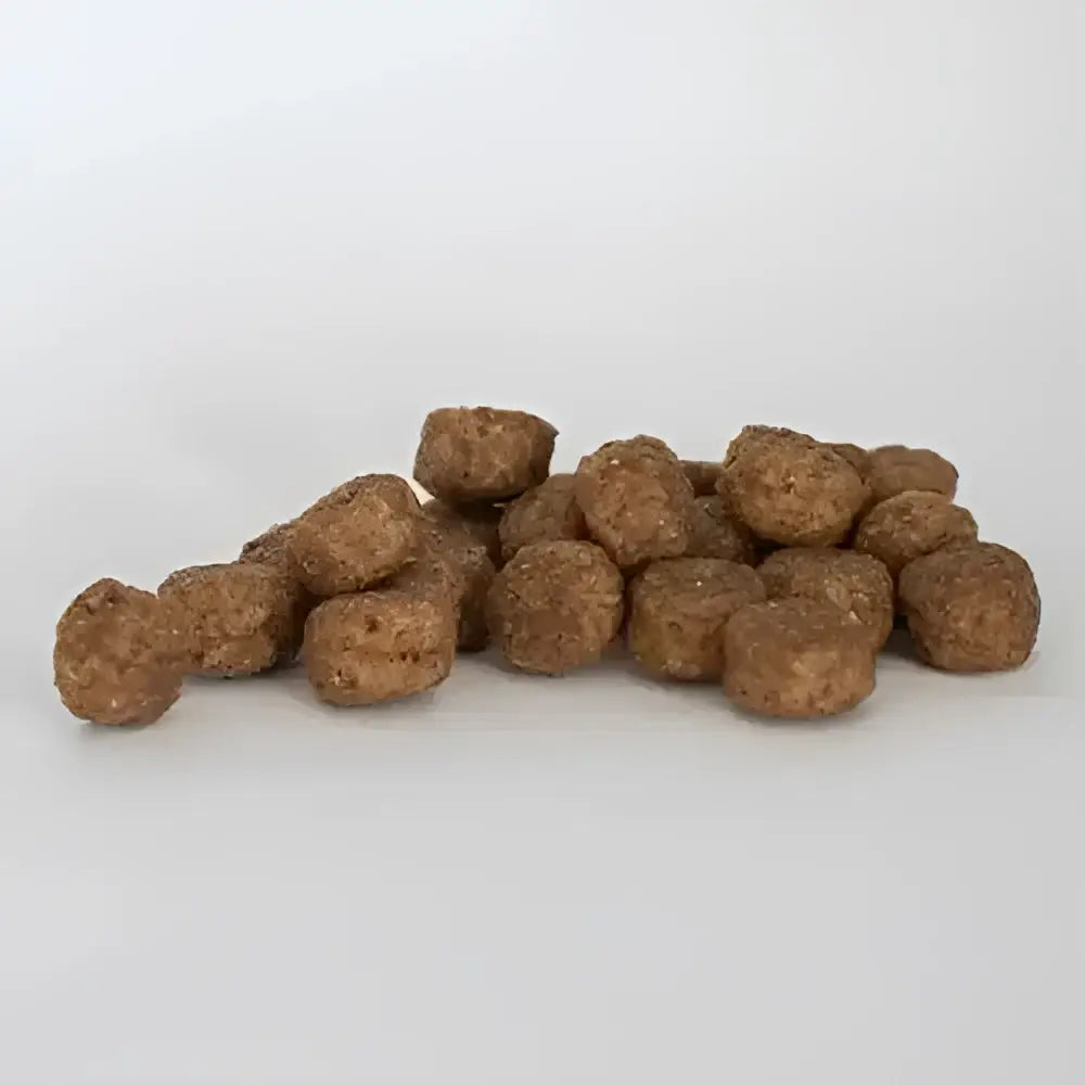 Brown round kibble pellets for skinners field complete working dog food working trial use