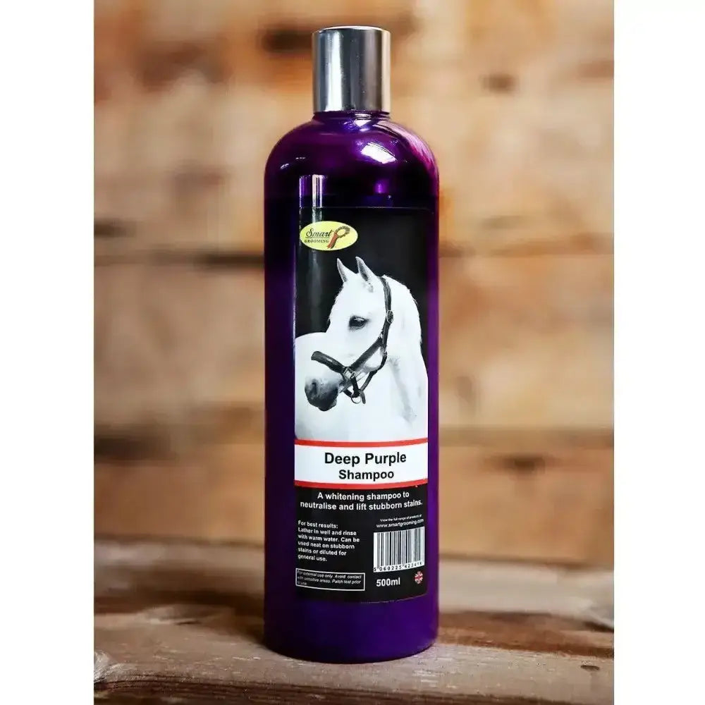 A 500ml glossy purple plastic bottle of smart grooming deep purple whitening shampoo by banned products with silver cap