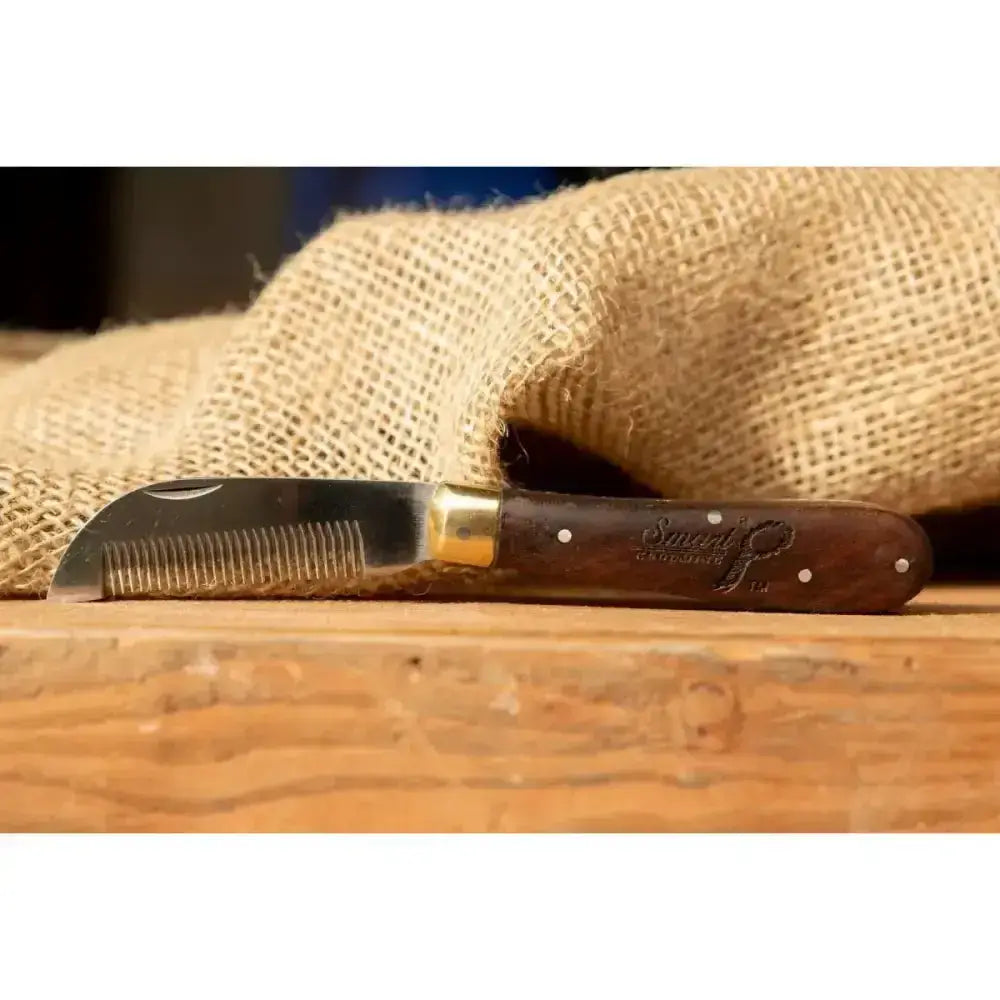 Smart grooming folding pruning knife with dark brown wooden handle and curved serrated blade for thinning hair
