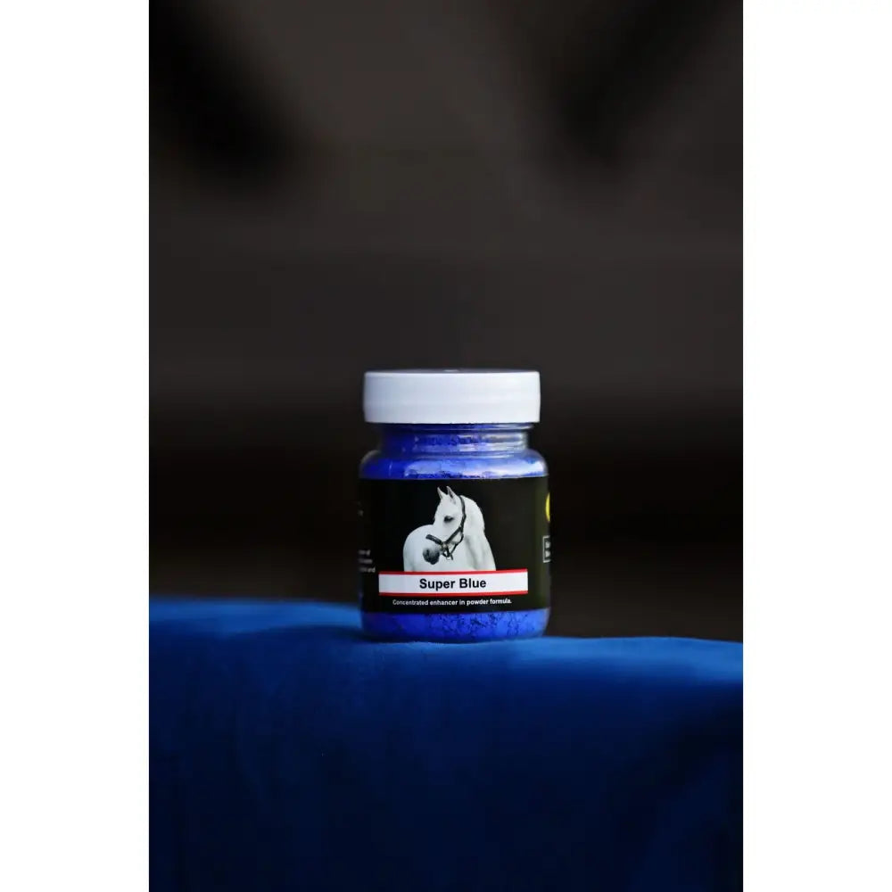 A vibrant blue jar with white lid and black label featuring a horse, smart grooming super blue whitening powder 30g
