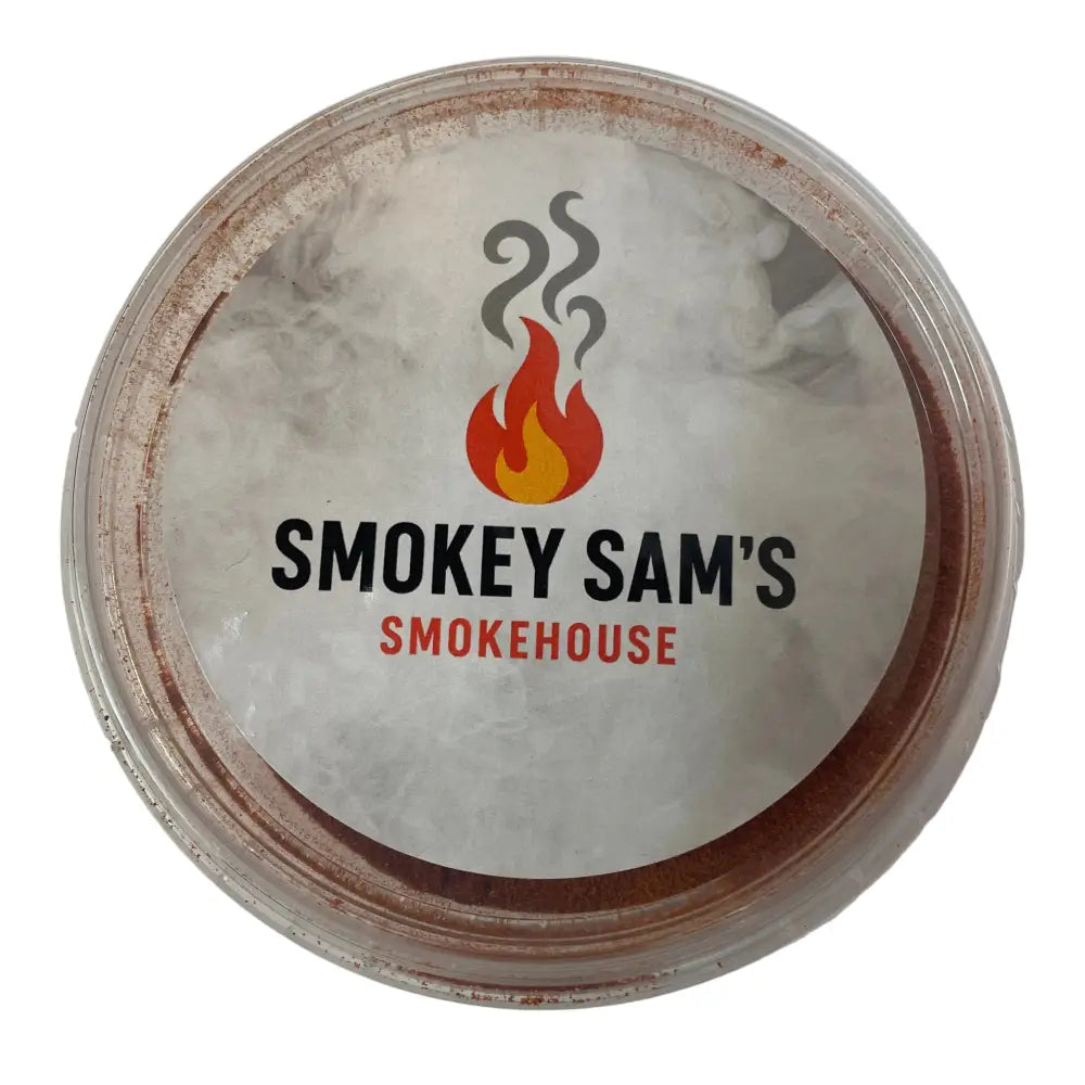 A round clear plastic container with a white label showing smokey sam’s logo for sam’s smoked paprika