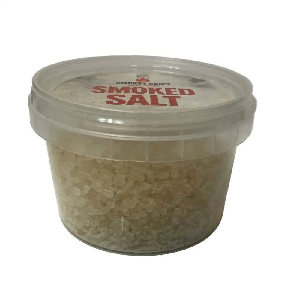 Clear plastic container of smokey sams smoked salt with red label and transparent lid featuring premium sea salt