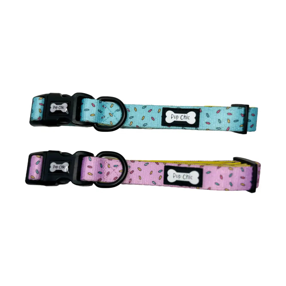 Two pup days collar in pink and blue with playful sprinkle fabric and black plastic buckles for stylish pups
