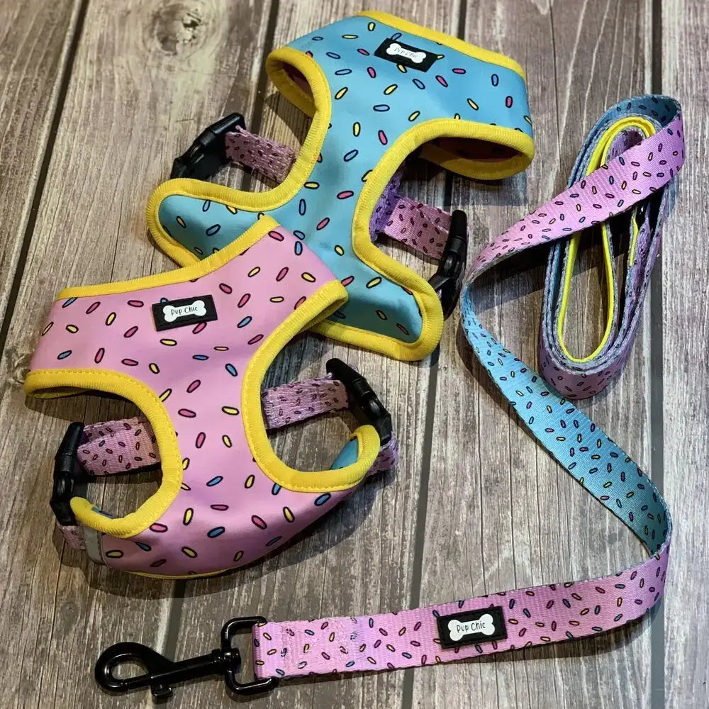 Pastel pink and blue sprinkle print reversible dog harness with yellow trim and matching leash from sprinkles for days collection