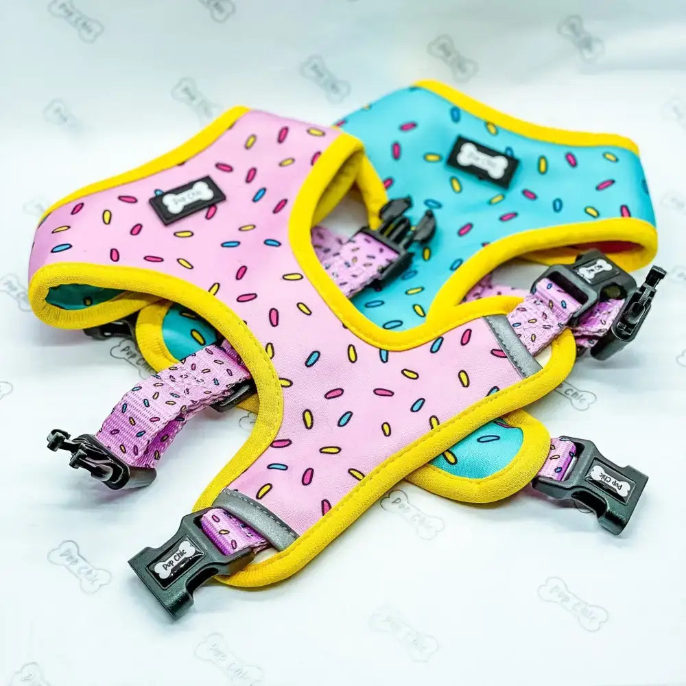 Pink and blue reversible dog harness with sprinkle print yellow trim in sprinkles for days reversible size guide design