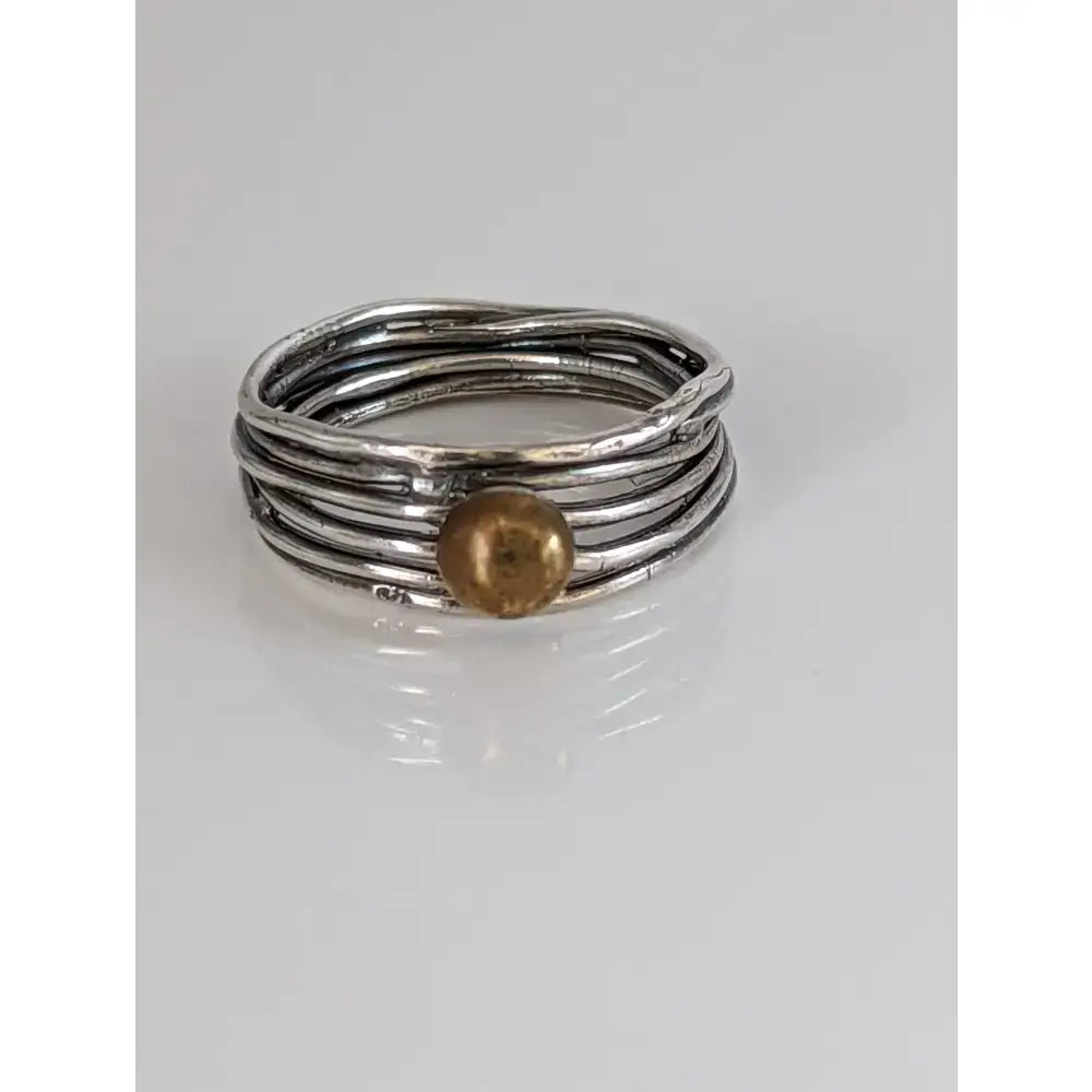 Steed silver wired multi-strand ring with a twisted silver band and a central brass ball detail