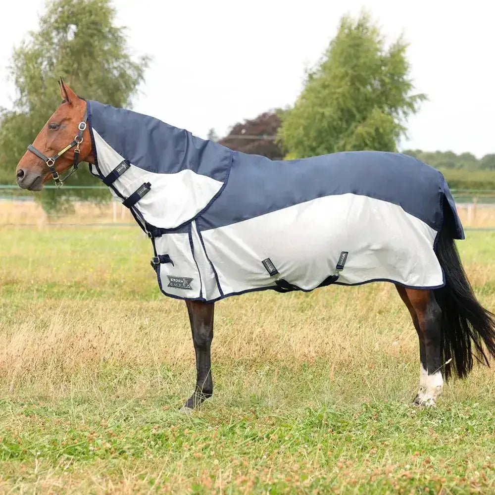 Navy and white two-tone stormx empra aqua shield fly rug with black trim and adjustable straps for horses