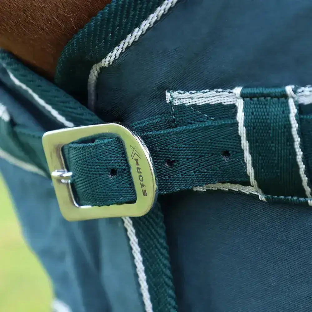 Dark green woven fabric belt with silver metal buckle featuring storm brand name for stormx empra pima cotton sheet