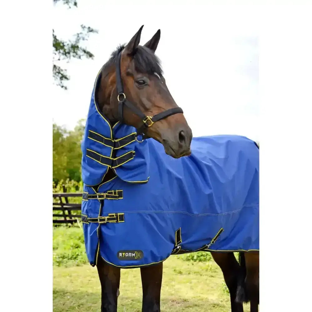 Blue stormx original 100 combi turnout rug with denier waterproof outer and black yellow trim for horses