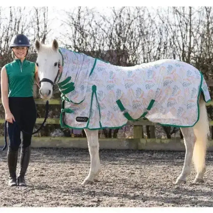 White horse blanket with green trim and colorful feather pattern in stormx original tropical paradise combi fly rug