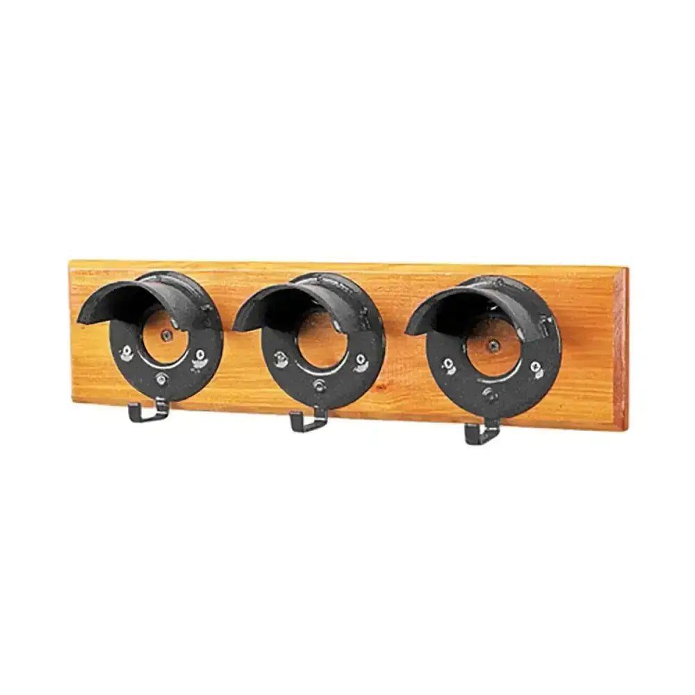Black metal stubbs bridle rack with three round cowl hooks mounted on light brown wooden board s203