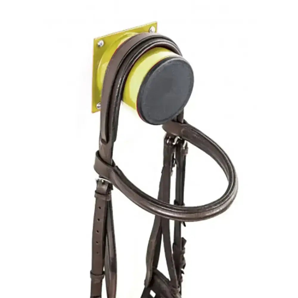 Brown leather horse bridle stubbs bridle stub s2075 hanging on yellow wall bracket from europe’s leading bloodstock auctioneers