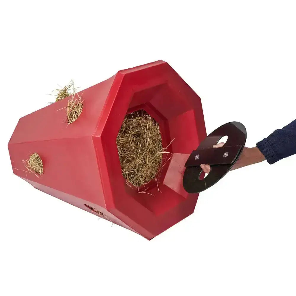 Red octagonal stubbs lidded hay roller pony with black handle pulled open to show straw inside