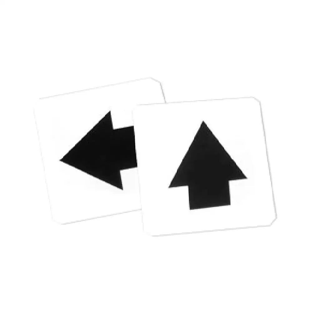 Two white square adhesive labels direction markers s631l with bold black arrows pointing left and right by stubbs