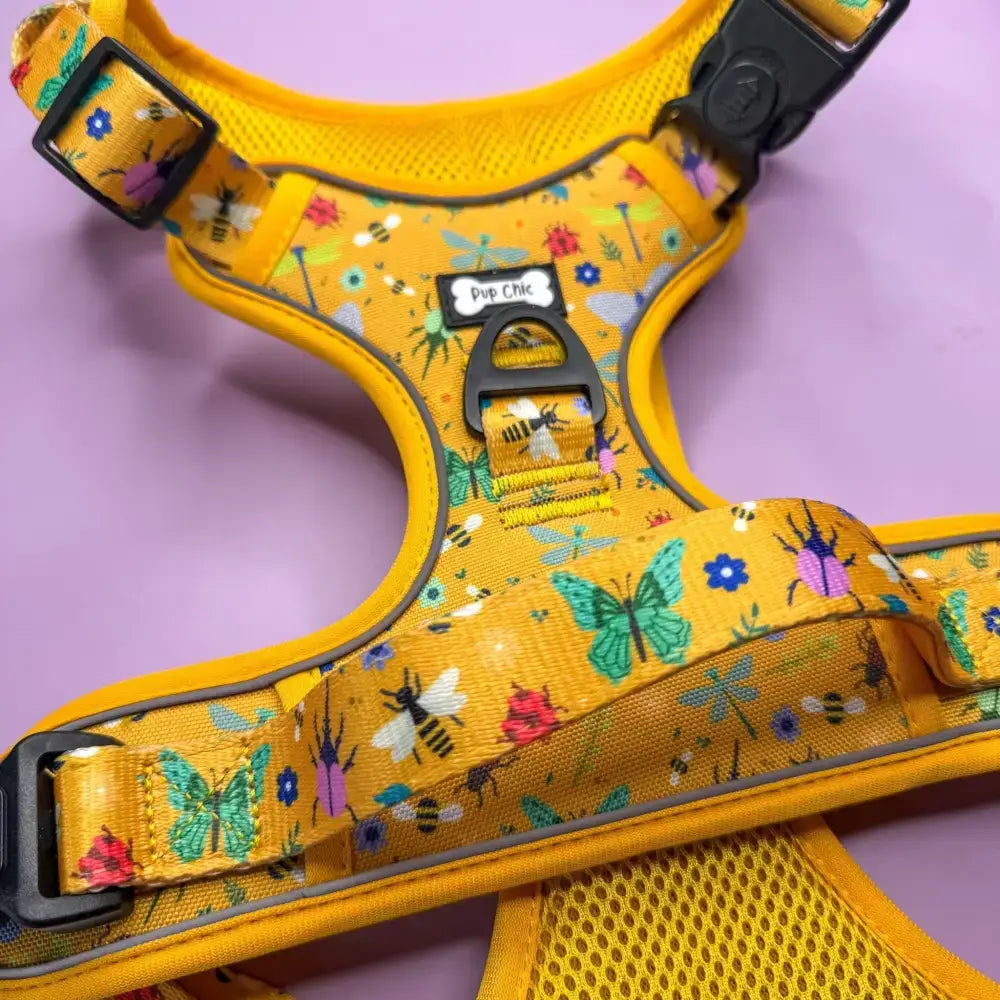 Vibrant yellow insect print tactical dog harness with playful butterfly bee and flower pattern buzzin tactical dog gear
