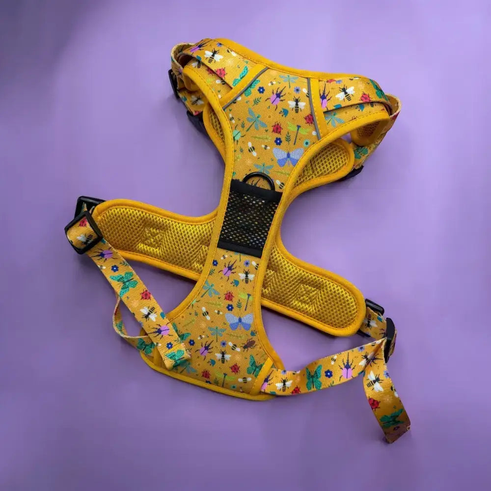 Yellow insect print tactical dog harness with buzzin mesh fabric featuring bees butterflies and flowers design