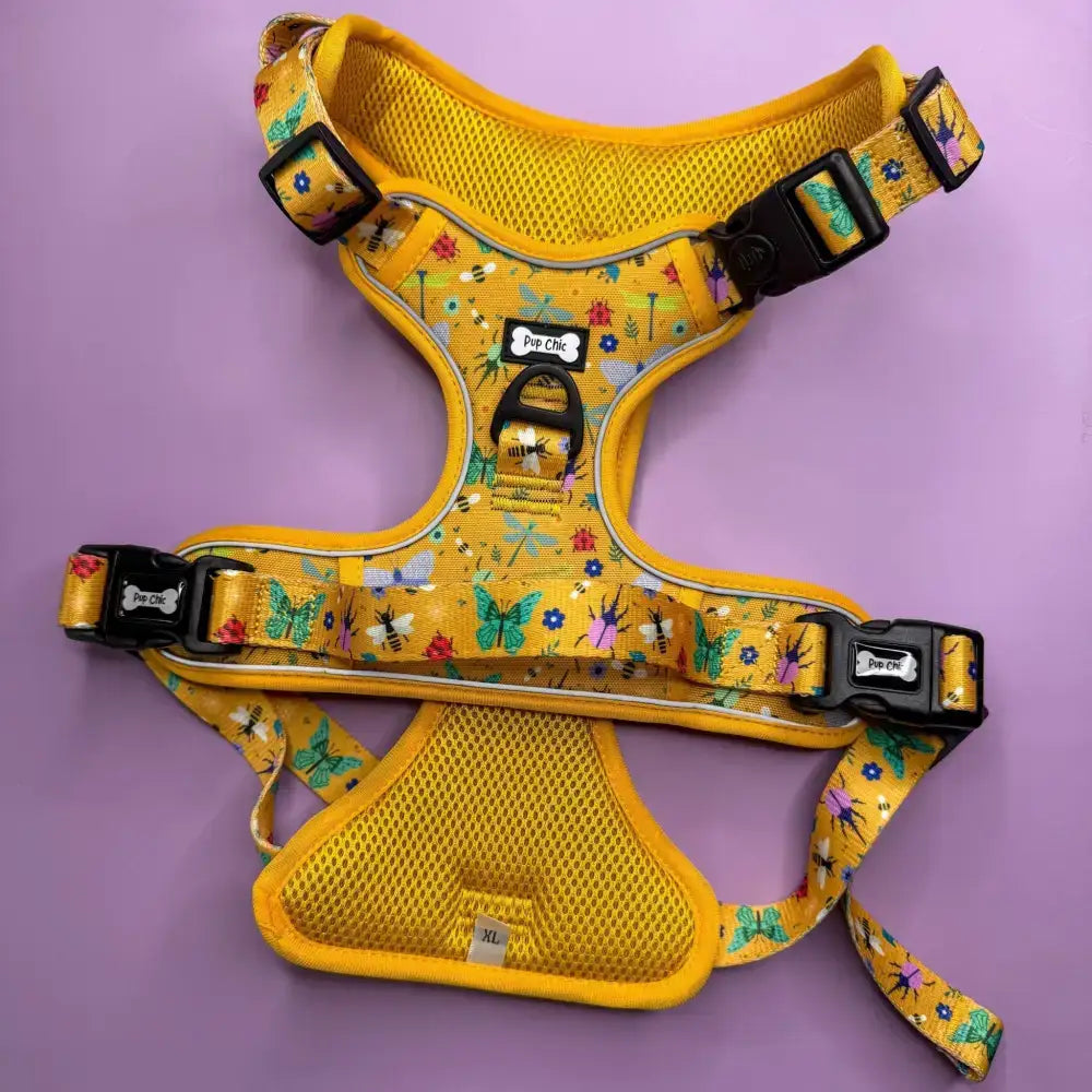 Yellow insect print tactical dog harness with mesh padding black buckles and pup chic brand label summer buzzin no pull