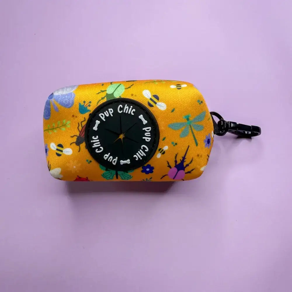 Summer buzzin mustard yellow fabric dog waste bag dispenser with pup chic logo for easy dog walks with colorful insects