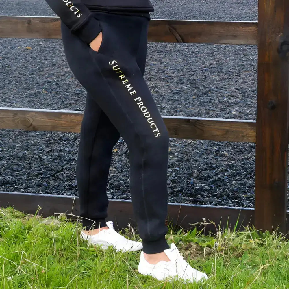 Black supreme products joggers with white lettering down the side perfect for active rider joggers style