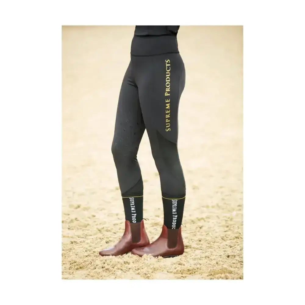 Black supreme products active rider leggings with gold lettering and ankle cuffs for a flattering fit