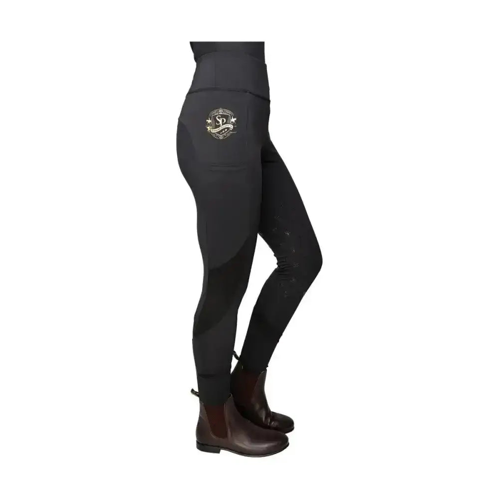 Black high waisted rider leggings with gold embroidered logo on thigh from supreme products active with flattering fit