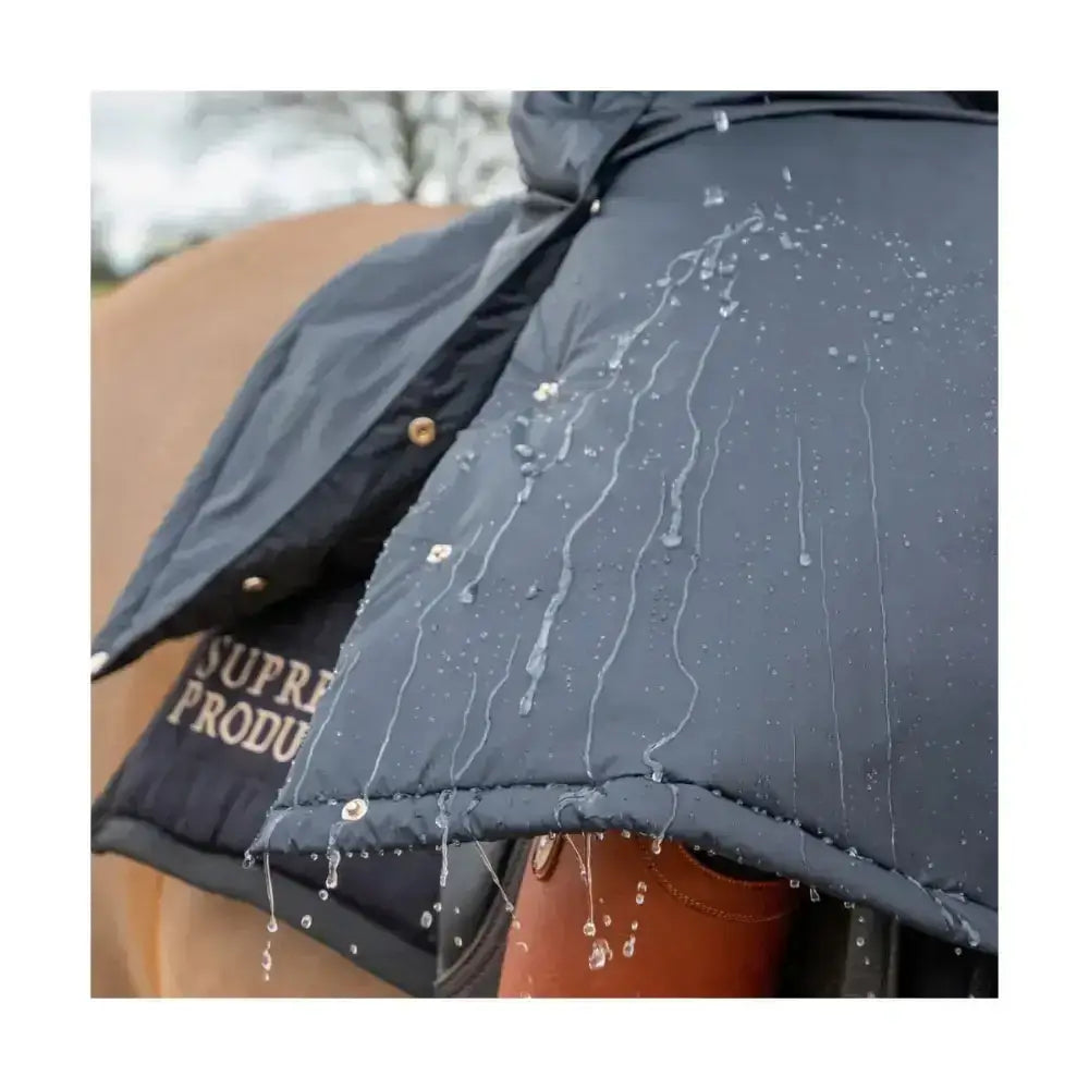 Black quilted waterproof rider coat from supreme products active with water droplets on the surface