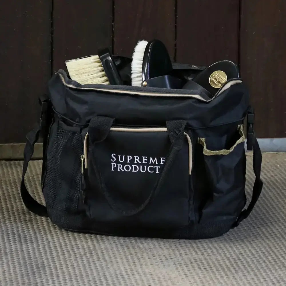 Black supreme products complete pro groom perfection equestrian tack bag with gold zippers and mesh pockets filled with tools