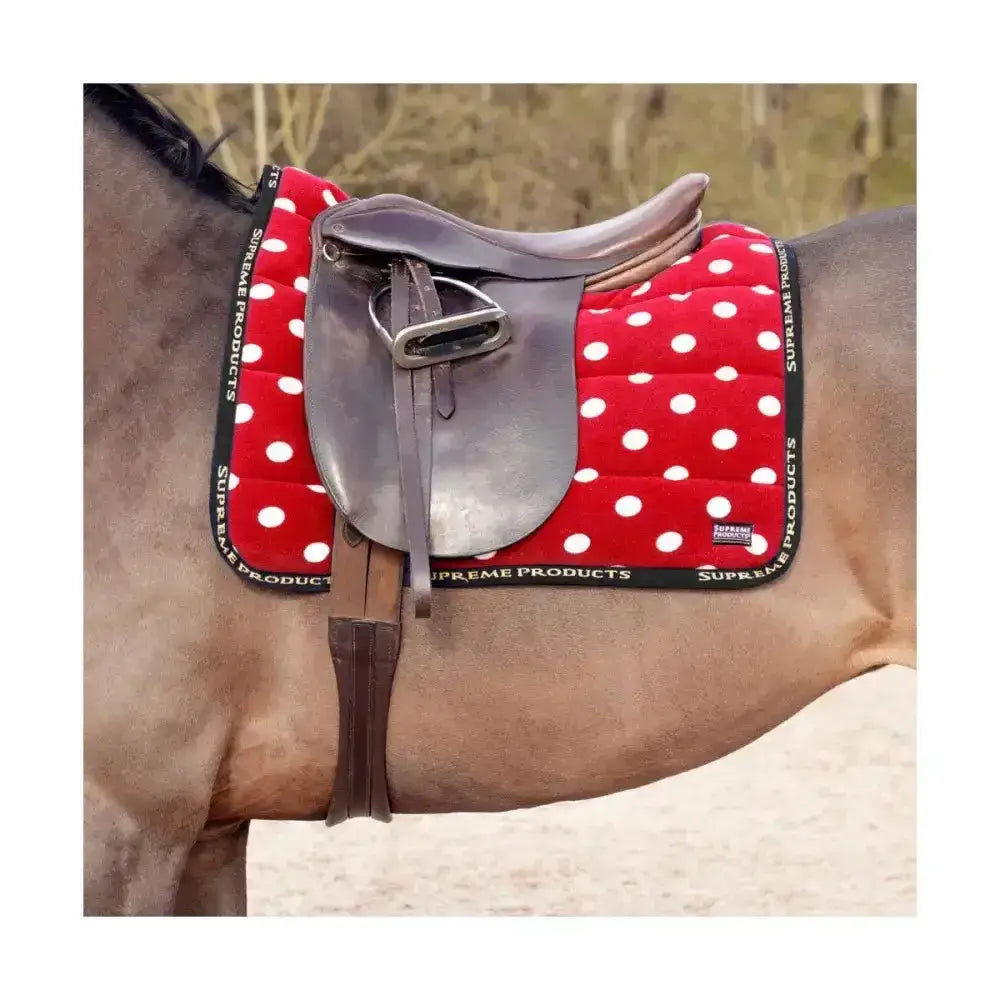 Red polka dot fleece saddle pad with white dots black trim branded supreme products dotty fleece saddle for horses