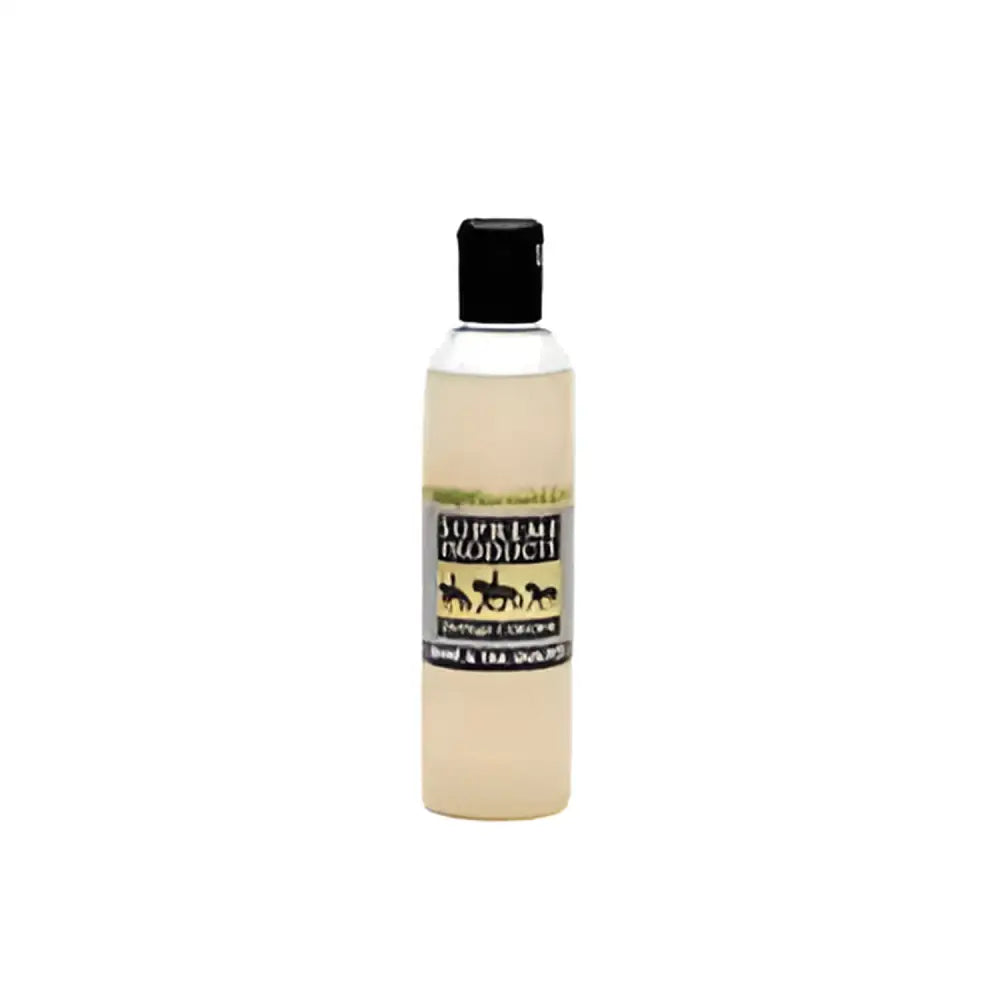 A clear plastic bottle with black cap holding pale yellow supreme products heritage mane and tail builder to regenerate hair growth
