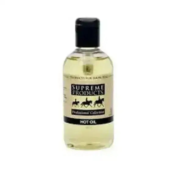 A clear plastic bottle with black cap containing pale yellow supreme products hot oil professional collection calm hot oil