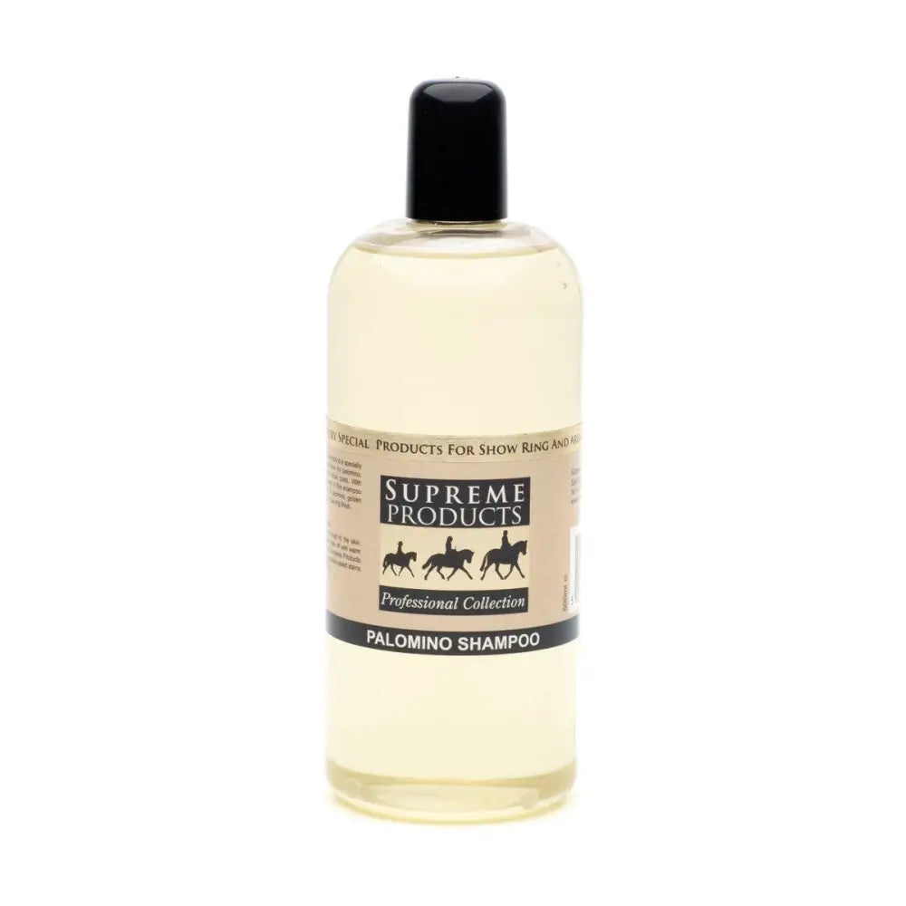 A clear plastic bottle with black cap holds pale yellow palomino shampoo from supreme products for palomino coats