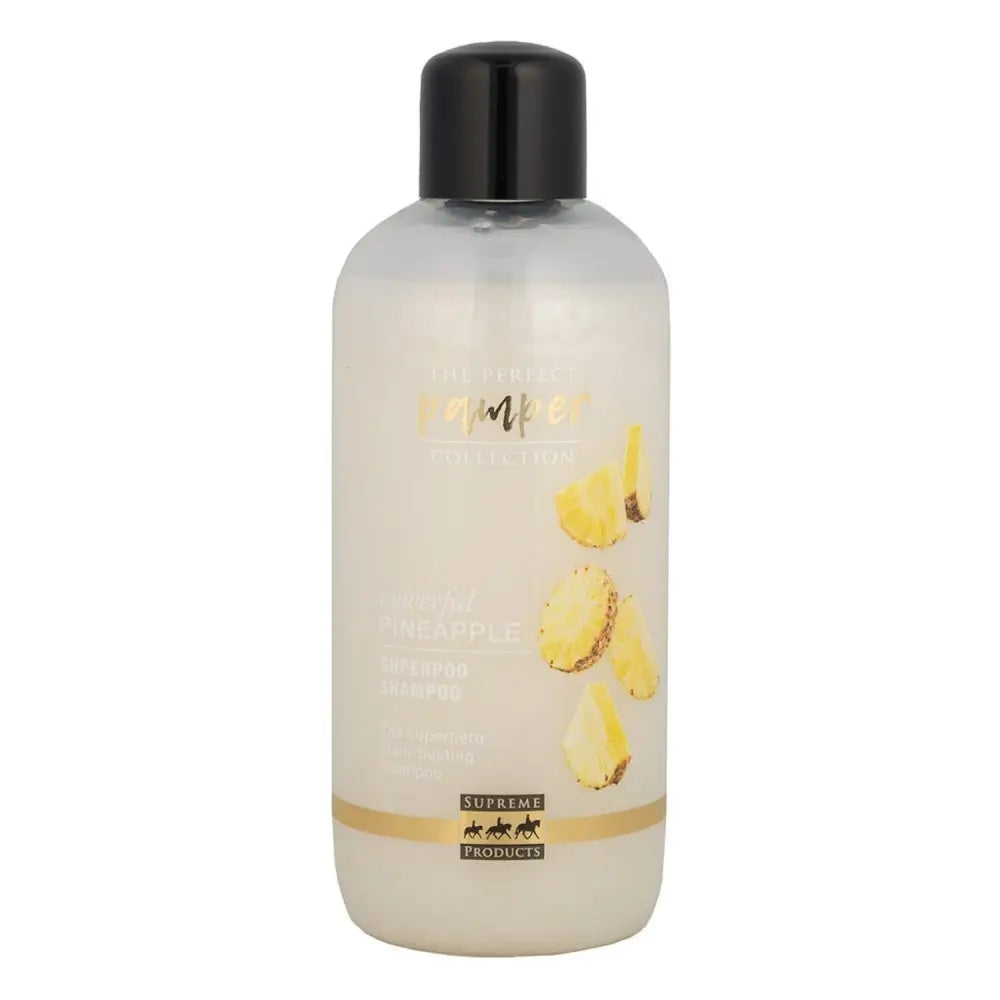 Clear plastic bottle with black cap labeled pomper featuring pineapple slices for supreme products powerful pineapple superpoo shampoo