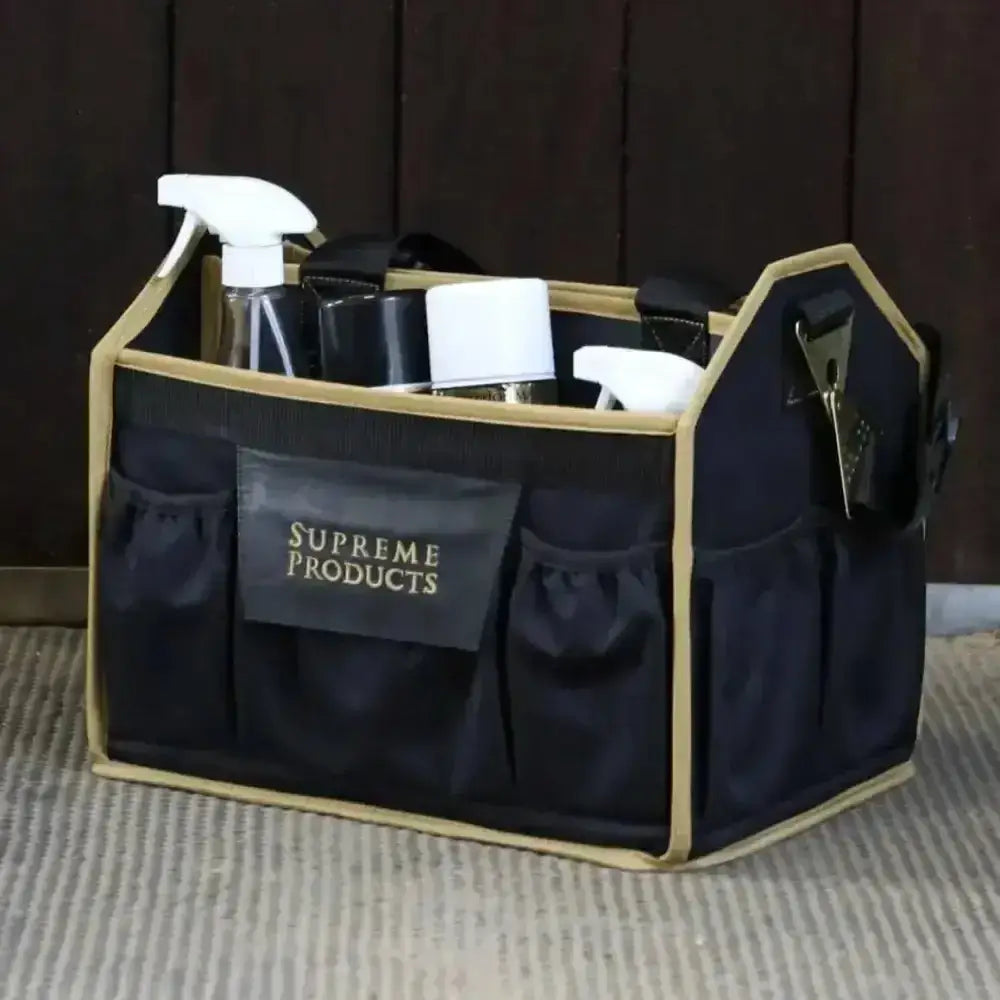 Black and gold supreme products pro utility caddy with multiple pockets holding cleaning supplies for pro groom accessories