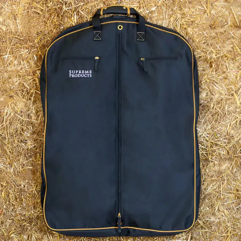 Black supreme products pro groom garment bag with gold trim and zipper details for competition ready condition