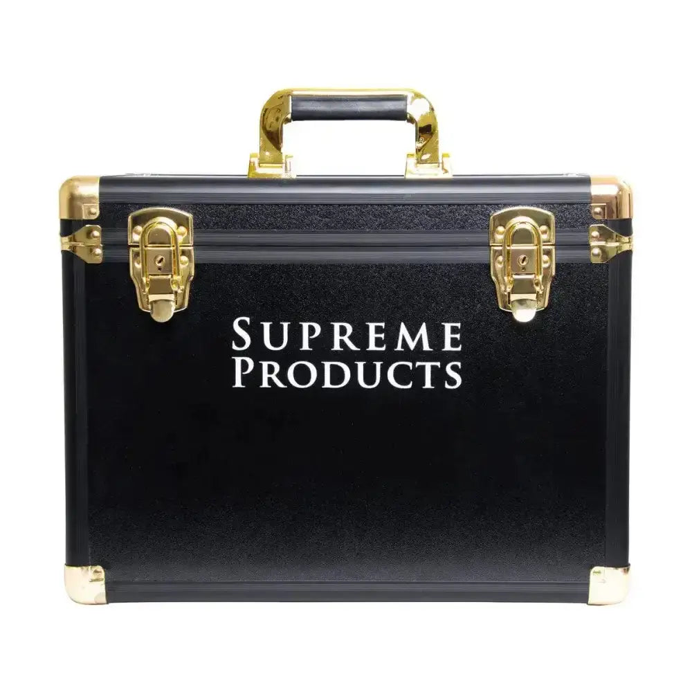 Black supreme products pro groom hardshell box with gold metal latches and handle for secure grooming tool storage