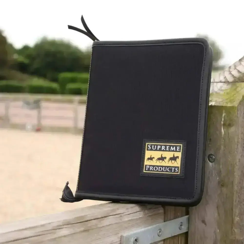 Black supreme products pro groom passport holder with gold and black logo patch featuring three horse silhouettes