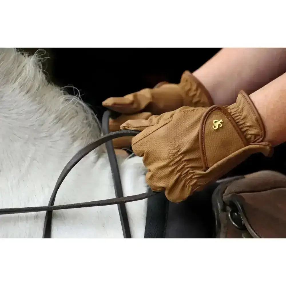 Tan leather slimline performance ring riding gloves by supreme products pro with gold logo on wrist back side visible