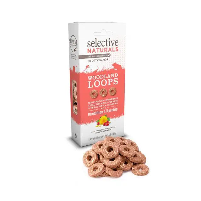 A pink and white package of supreme selective nat woodland loop4x80g with dandelion and rosehip flavor for guinea pigs
