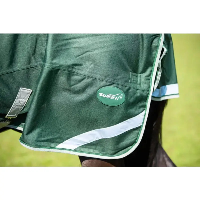 Green swish 200g detachable neck turnout rug with white trim and reflective stripes for horses