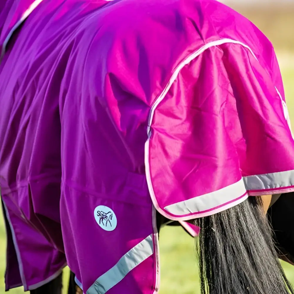 Swish 50g detachable neck turnout rug in vibrant purple with pink hood clip chest reflective stripes and white trim