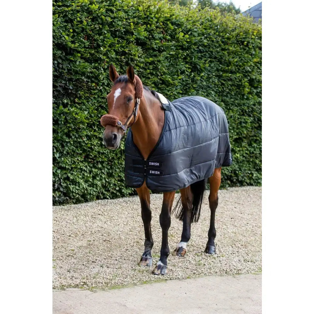 Dark gray quilted 50g horse rug liner with black straps and swish branding perfect for layering under rugs with storage bag