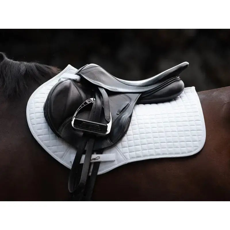 Black leather dressage close contact gp saddle with silver stirrup iron on white quilted saddle pad orange for high wither